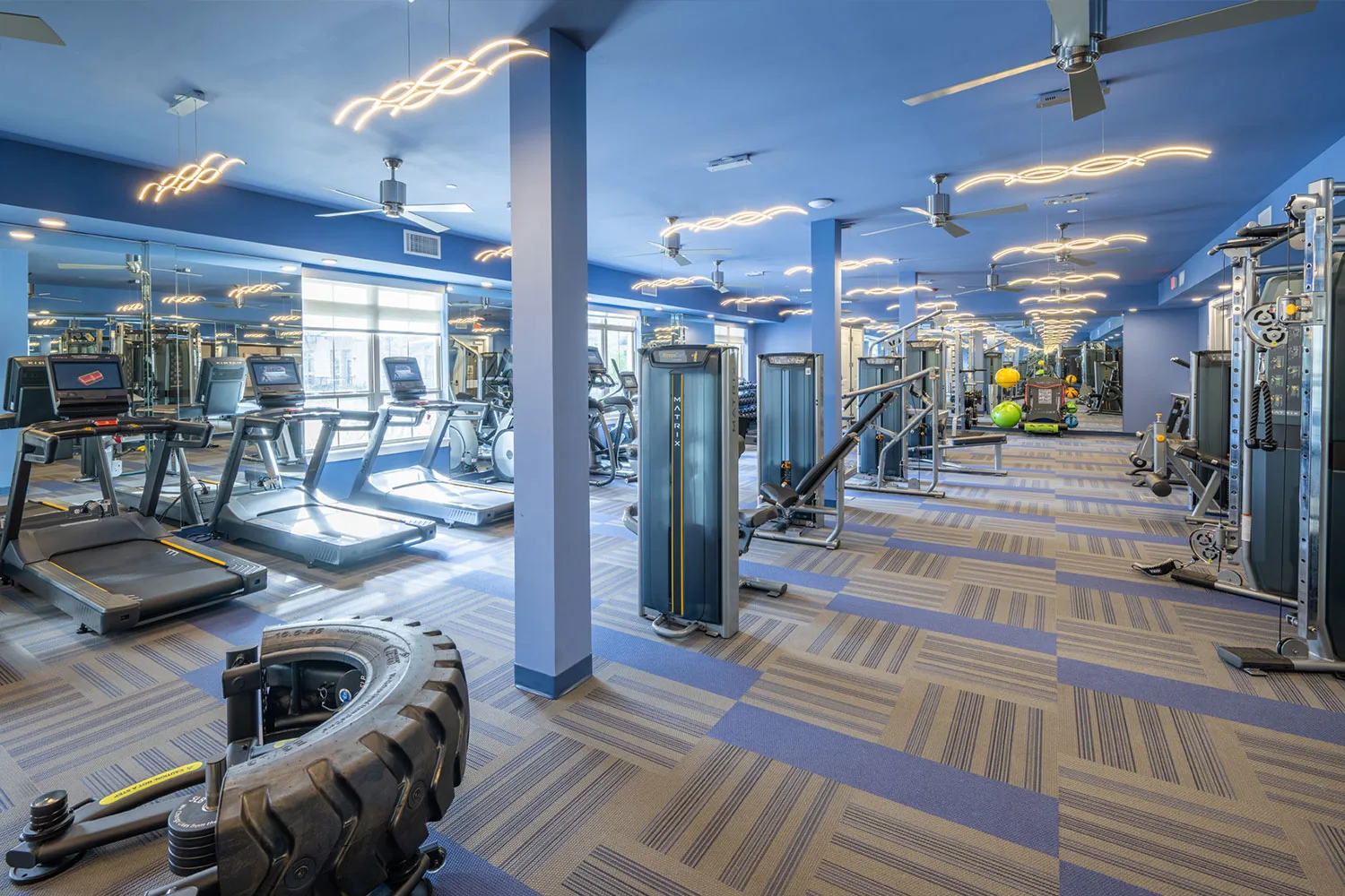 Apartment fitness center in Schaumburg, Illinois, with Matrix treadmills, selectorized machines and carpet tile