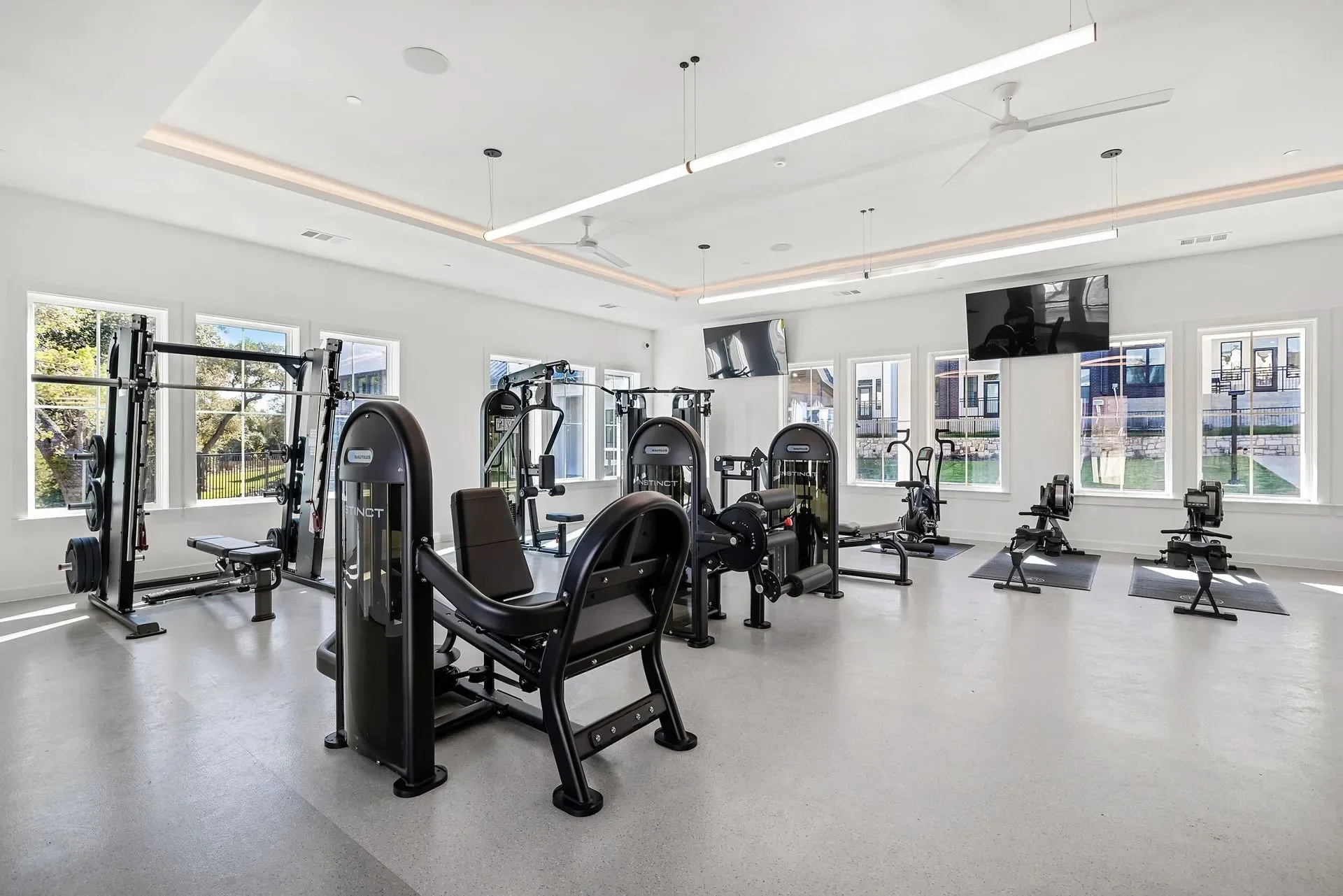 Strength room in an Austin, Texas apartment gym with Nautilus Instinct machines and a cable crossover