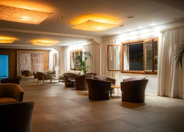Recovery lounge with massage loungers and low lighting