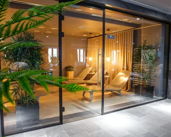 Recovery spa suite with a plunge pool, stone finishes and planting