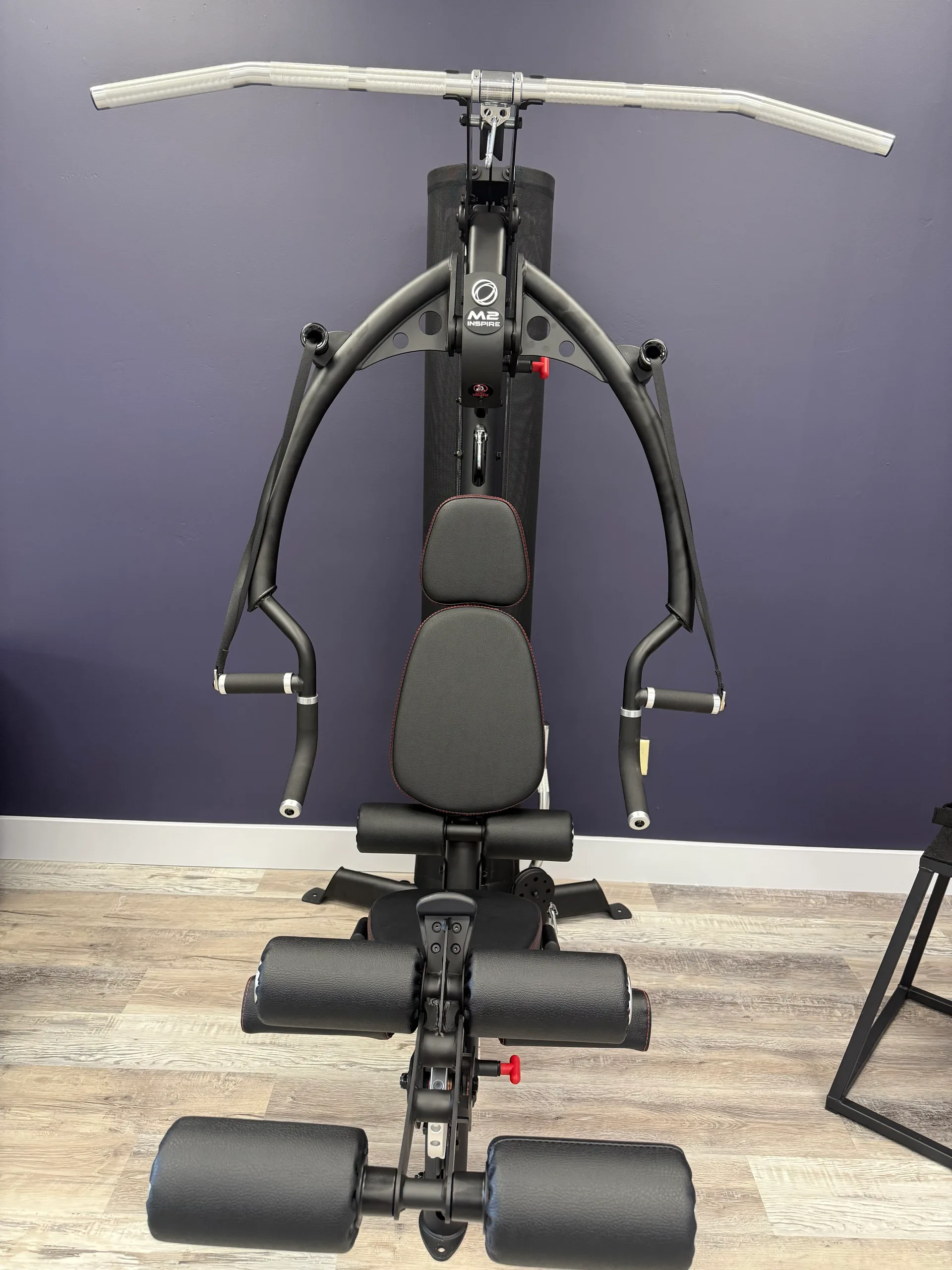 Inspire M2 multi-gym functional trainer with an adjustable bench at an Arizona apartment amenity gym