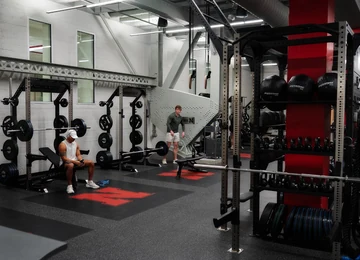 Rolled rubber and lifting platforms in a commercial weight room