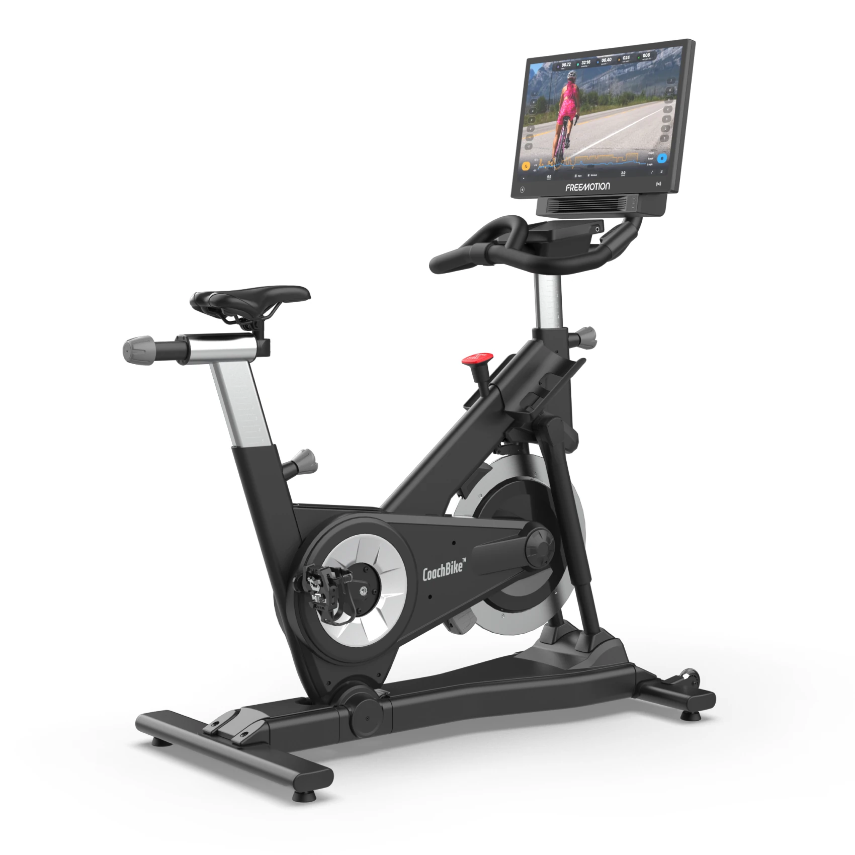 Black FreeMotion CoachBike indoor cycling bike with a large touchscreen console and adjustable handlebars
