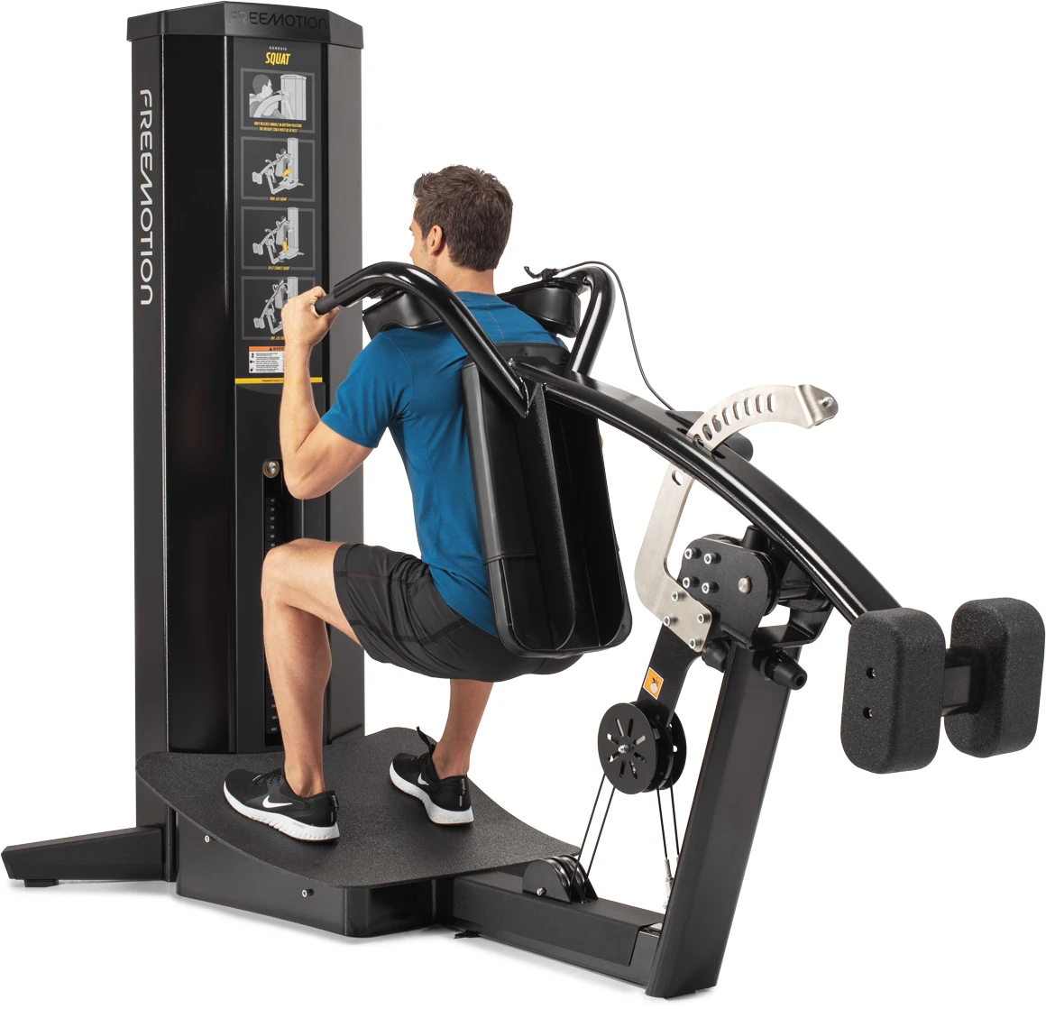 Black FreeMotion GENESIS Squat machine with counterweighted shoulder pads on a curved textured platform