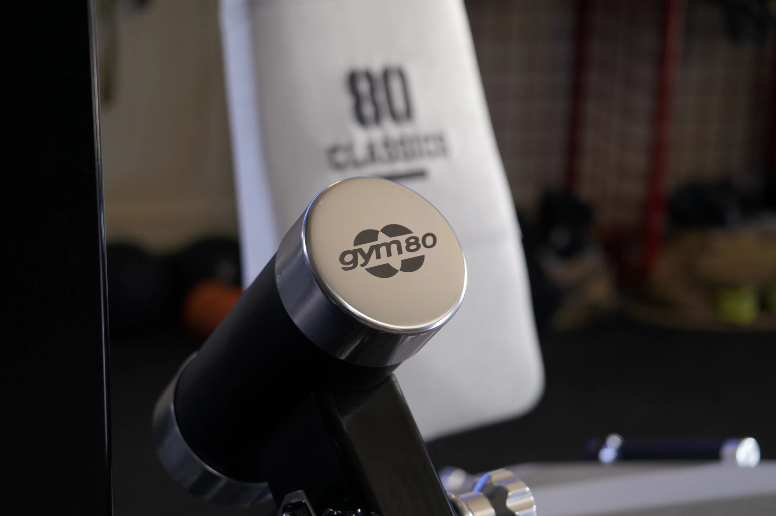 A GYM80 80Classics machine handle grip, stamped with the gym80 logo