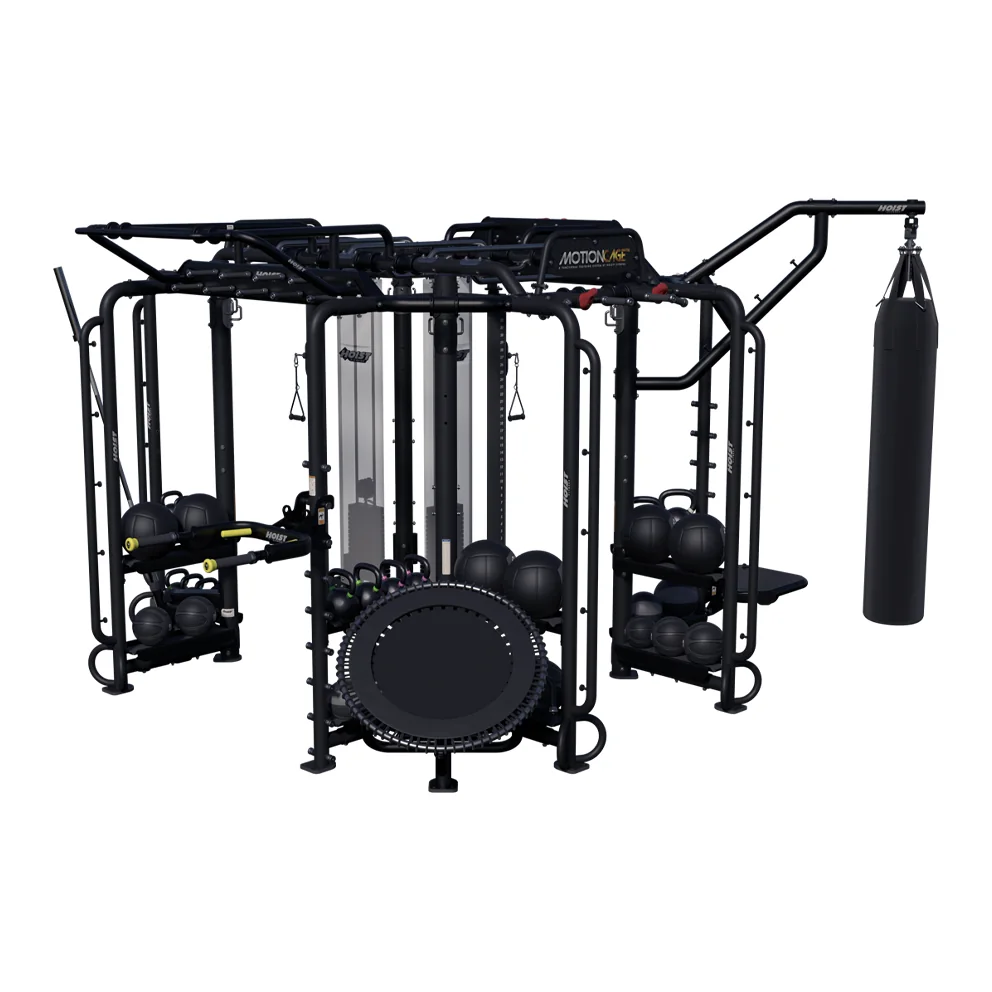 Black HOIST MotionCage functional training rig with a rebounder, a heavy bag and medicine balls