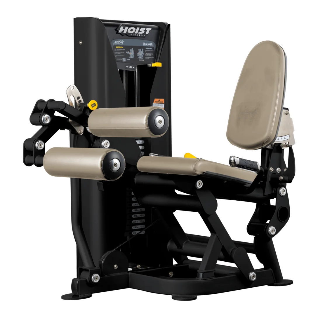 Black HOIST ROC-IT RS-2402 leg curl with a beige seat and back pad and roller pads
