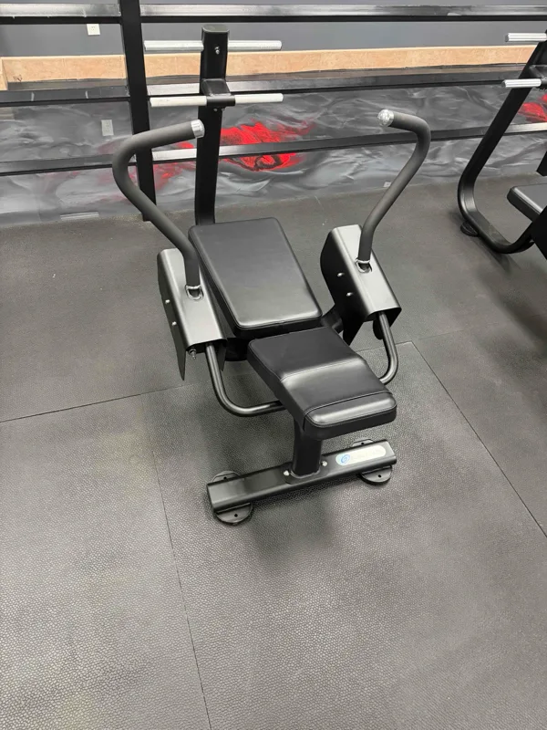 Glute and back extension bench against a red accent wall at a Jacksonville, Florida commercial gym