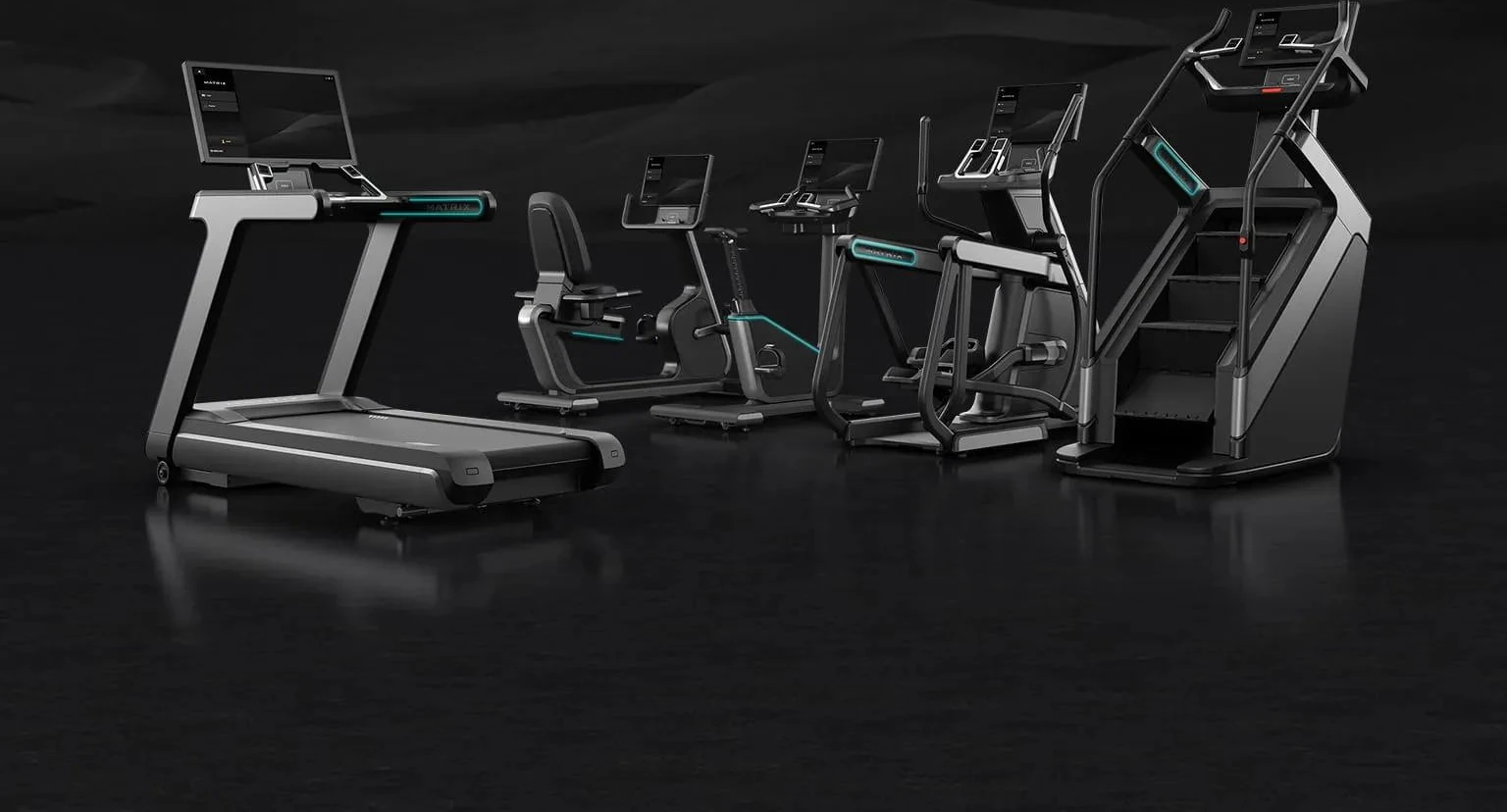 Five Matrix Onyx cardio machines with teal accent lighting on a dark reflective floor