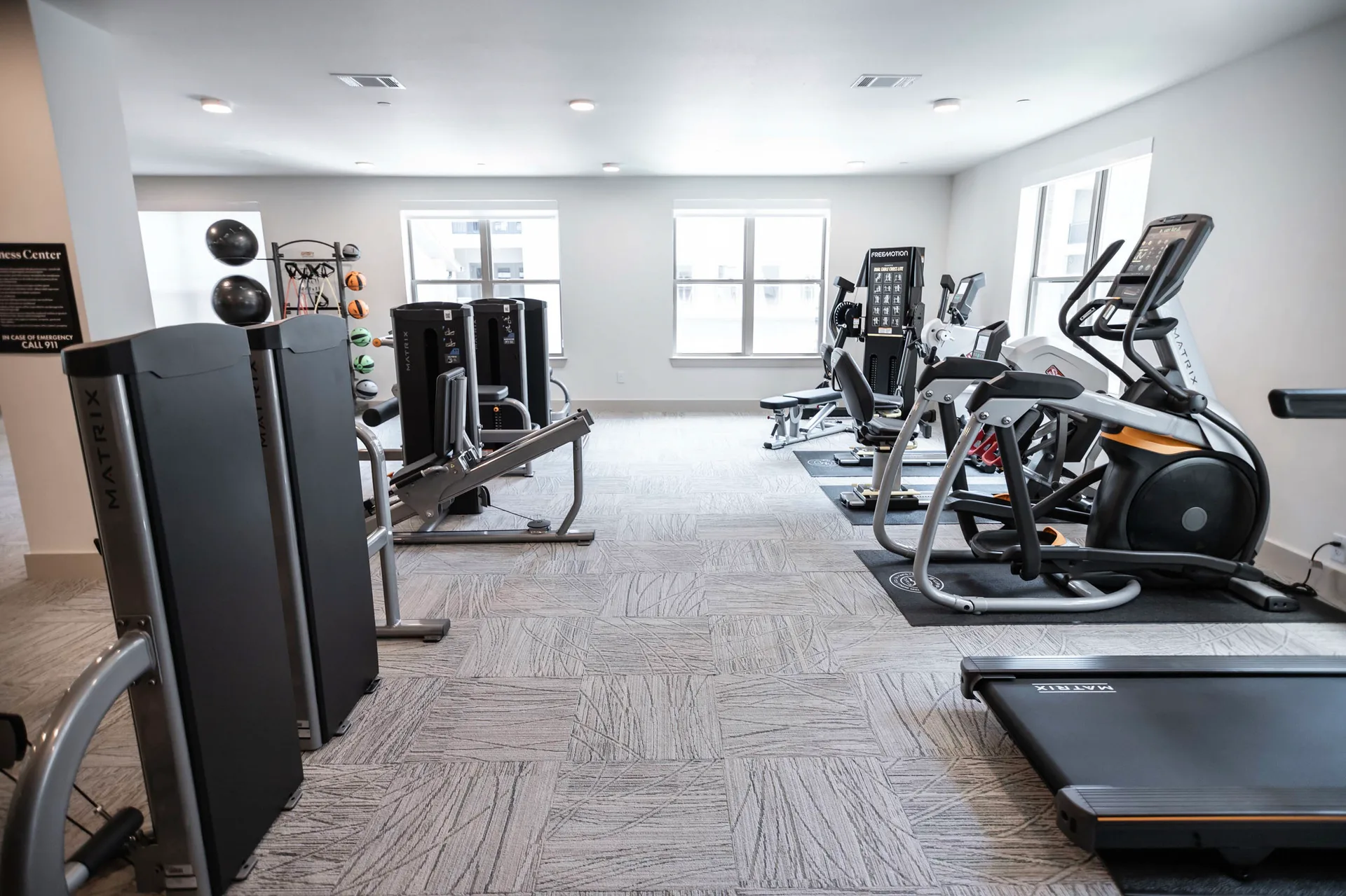 Matrix GO strength line, a FreeMotion cable cross and SciFit and Matrix cardio in a McKinney, Texas senior living gym