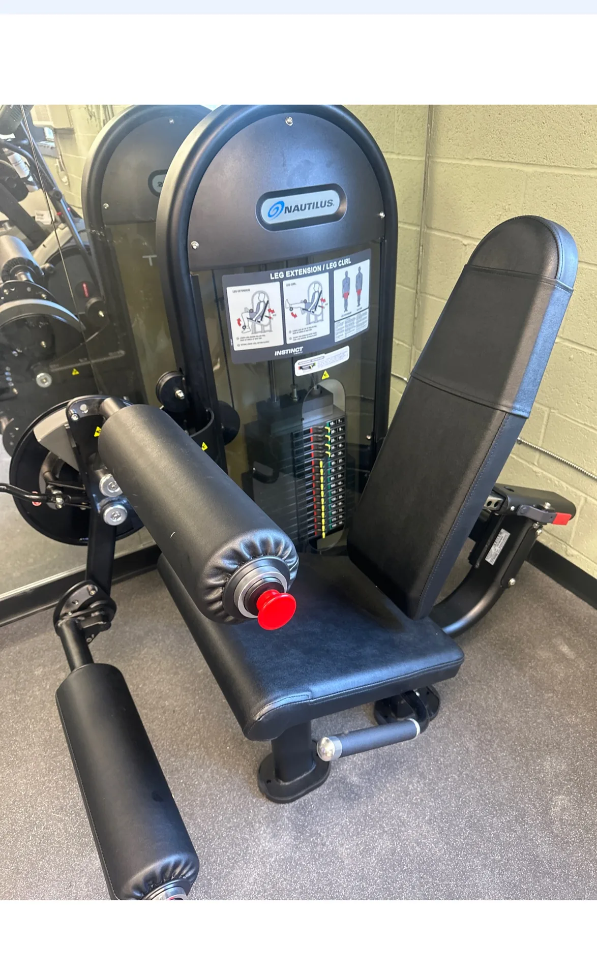 Selectorized leg machine with blue upholstery at a Nottingham, Maryland apartment gym