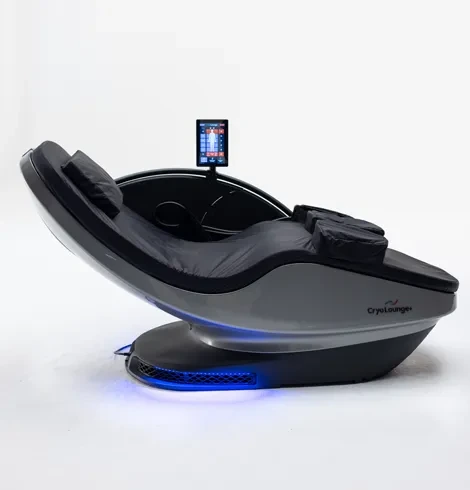 A black and silver CryoLounge+ chair, empty, shown at a 3/4 angle with its console and blue base accent lighting