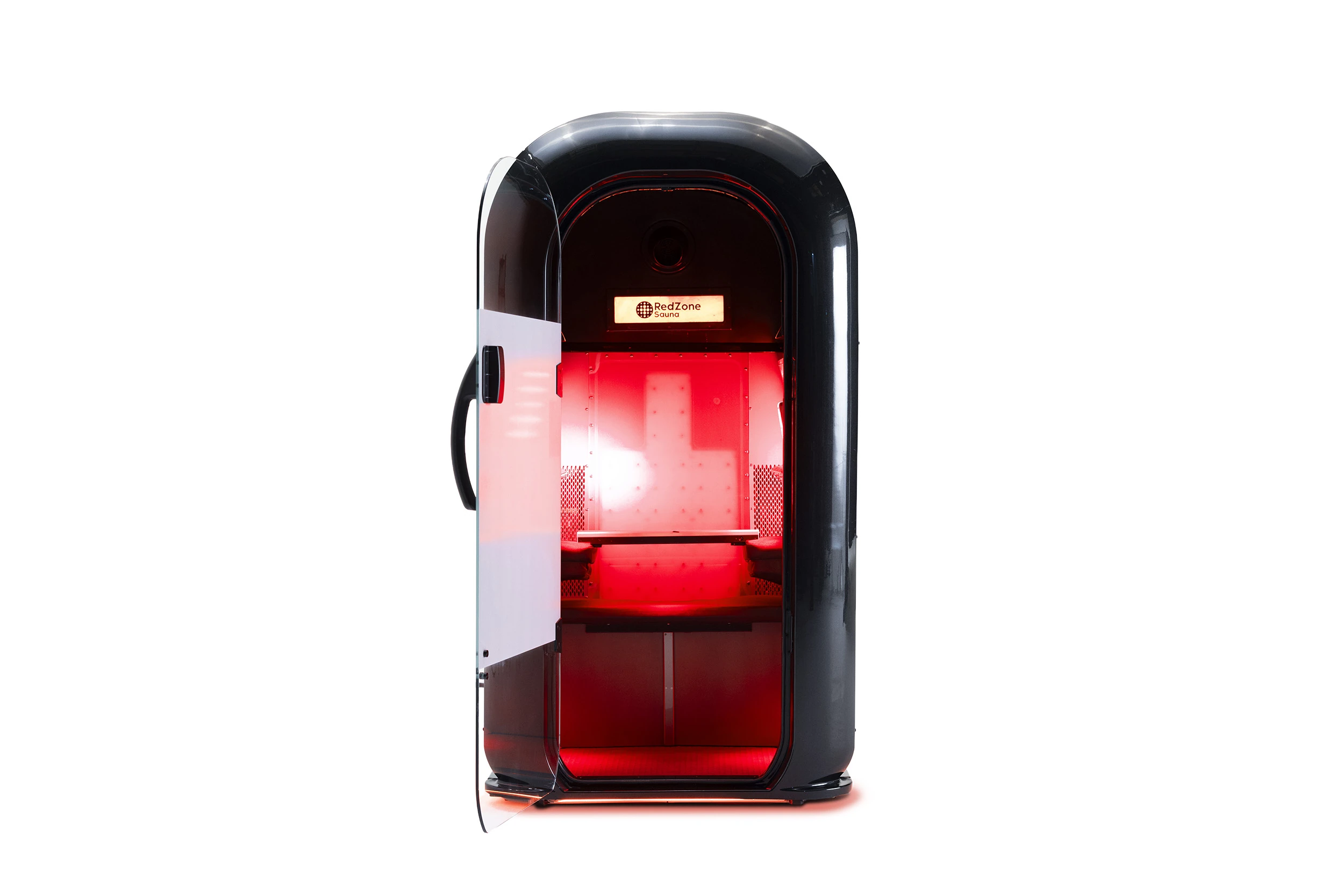 A black RedZone infrared sauna cabin with its door open, showing a glowing red interior and bench seating